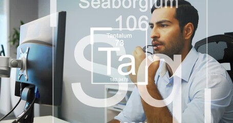 Animation of chemical elements over caucasian businessman working on computer
