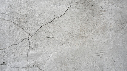 Obraz premium old plaster on the wall, cement, adhesive for screed. the old clay wall is crumbling. surface wall for vintage background. Wall texture, cracked plaster, grey cement floor, needs repair, restoration