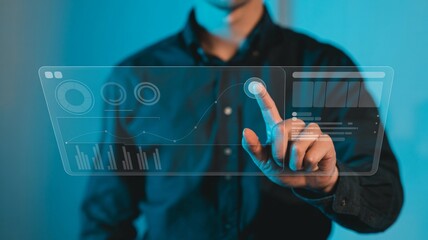 Businessman interacting with futuristic digital interface for data analysis
