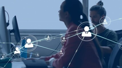 Animation of network of connections with icons over diverse business people using computer at office - Powered by Adobe