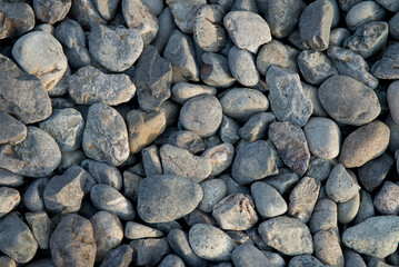 Small, round stones used for placing on pathways as garden decoration.