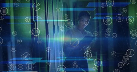 Animation of floating media icons over caucasian female technician working in server room - Powered by Adobe