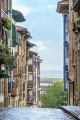 Hondarribia Old Town Street with Traditional Balconies and View of the Sea, Basque Country, Spain