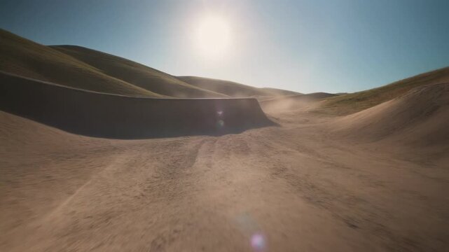 Rolling hills landscape with bright sun and moving dust