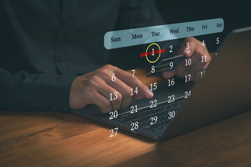 Adult man holding credit card with digital calendar on laptop, symbolizing bill payment reminders, credit card debt, and personal finance scheduling. Financial pay off debts planning concept.