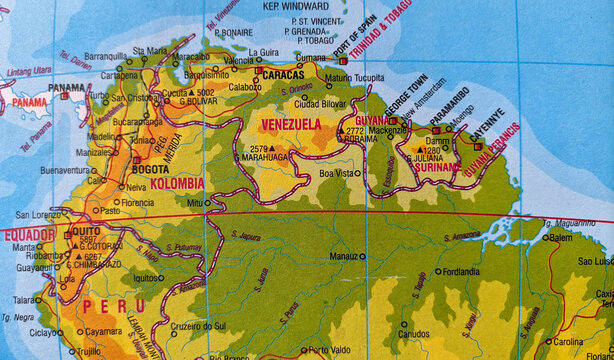 Close-up of a map of Venezuela and a map of Colombia showing the country borders. Selective focus