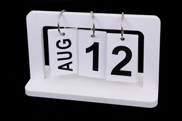 August 12 on calendar on black background