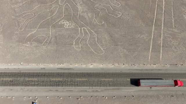Aerial � Truck on Panamericana road with the Nasca lines, Peru