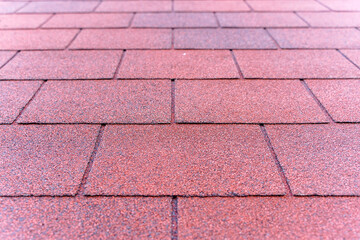 Red Bituminous Roof Shingle Texture Background with Granular Surface