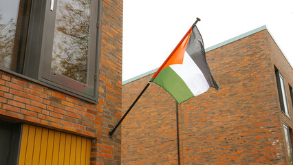 United arab emirates flag on brick building