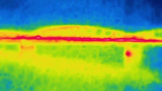 Driving through the streets of the city. Shooting from a car, taxi. Image from thermal imager device.