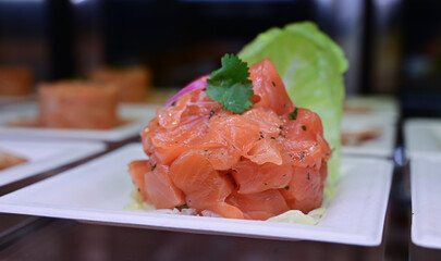 Gourmet salmon fish tartar raw from salmon fillet with glasswort nori and Japanese spice