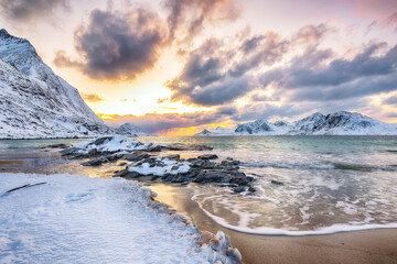 Unbeliveble winter view of Vik beach during sunset with lots of snow  and snowy  mountain peaks near Leknes.