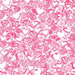 Seamless distressed pattern of hand-drawn hearts. Endless distressed background with a worn, weathered, and vintage texture. Grungy, scuffed vector illustration for wallpaper, wrapping paper, or texti