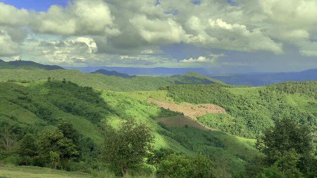 Slow Motion Mountain Landscape with Trees and Grassland, Moving Clouds