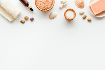 Fototapeta na wymiar Set of body care cosmetics products with essential oil scrubs and sea salt, top view. Aromatherapy spa products