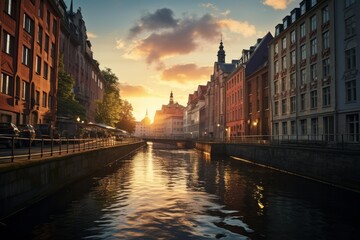 Urban canal lined with historic buildings at sunset creating reflections on the water
