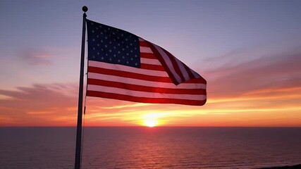 American Flag Waves Proudly Against a Vibrant Sunset Over the Ocean Horizon - Powered by Adobe