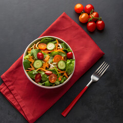 side close view of veggie salad on red napkin