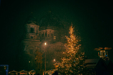 Iconic Berlin Cathedral Covered in Snow at Winter Time night