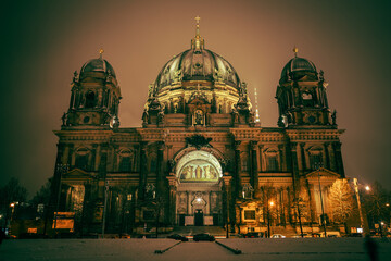 Iconic Berlin Cathedral Covered in Snow at Winter Time night