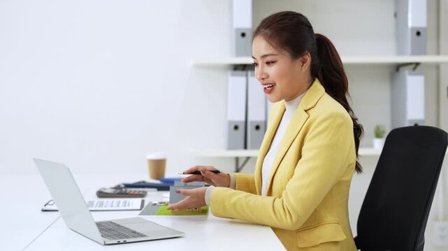 Asia business woman professional real estate sale agent talking explaining business contracts, lease agreements, loans and banks for new home purchase  via video call.


