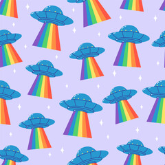 Seamless pattern with UFO spaceships projecting rainbow beams on a pastel background. Hand drawn illustration for kids designs, textiles, and wallpapers.