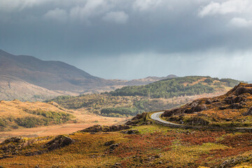 The MacGillycuddy&rsquo;s Reeks and the Ring of Kerry N71 road seen from Moll&rsquo;s Gap, a mountain pass in Killarney National Park, Ireland
