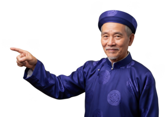 Elderly asian man in traditional blue attire pointing, smiling, and wearing a cap isolated on transparent background