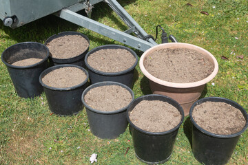 Flowerpots with potting soil