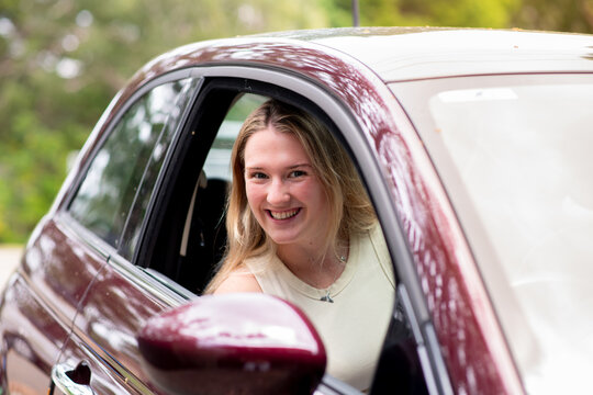young woman driver in her car