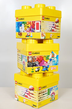 Minsk, Belarus - September 10, 2025: Lego Classic building blocks stacked in vibrant yellow boxes on a white background, showcasing creativity and imaginative play with copy space
