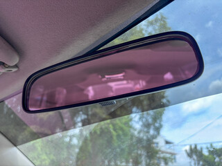 Car Interior Rearview Mirror View with Windshield Reflection