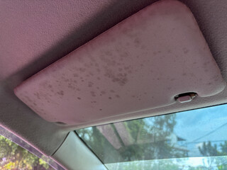 Close Up of Stained Gray Car Sun Visor Interior Detail