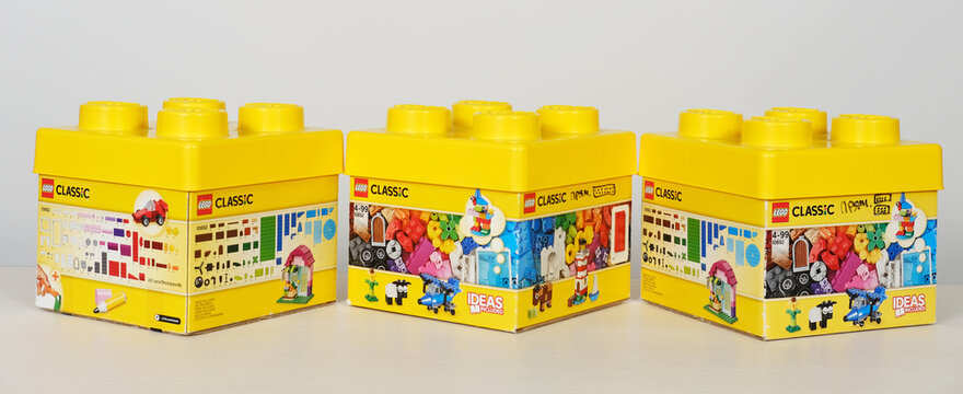 Minsk, Belarus - September 10, 2025: Lego Classic building blocks in vibrant yellow boxes displayed on a white background, showcasing creativity and playfulness with copy space