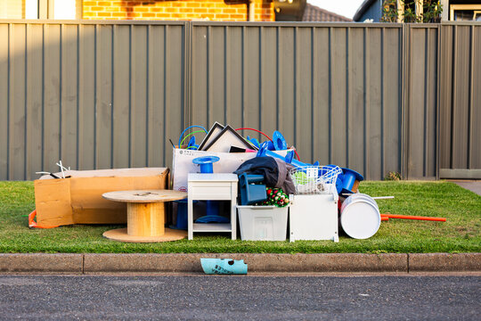 pile of junk and household rubbish on the kerbside for pickup during annual council cleanup  