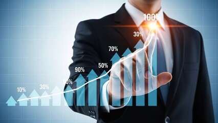 Businessman touching a glowing virtual bar chart showing 100% growth and success on a futuristic interface.
