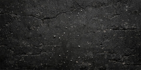 Obraz premium Rough black asphalt texture reveals a dark weathered stone pattern on an old bitumen road surface with a grainy gray tarmac pavement material