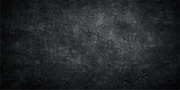 A dark black grunge concrete wall texture with a rough aged gray stone surface and dirty vintage paper pattern for a blank textured design backdrop
