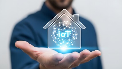 Man holding a smart home internet of things (iot) icon in his hand. Concept of connected devices and automation for modern living. Innovation technology.
