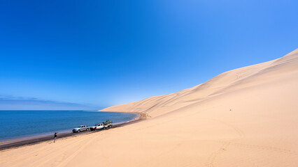 Changing tires in Southern Angola, the coast line at Iona National Park, part of Namib desert