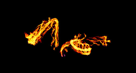 a long-exposure photograph of a fire performance, where a skilled performer spins flaming props like poi to create mesmerizing light trails and intricate patterns against the dark background