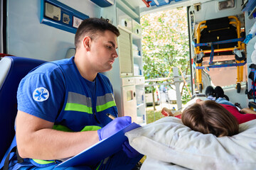 Emergency medical professional delivering intravenous treatment to female patient