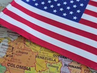 Flag of the United States placed on a map featuring South America including Venezuela and Colombia...