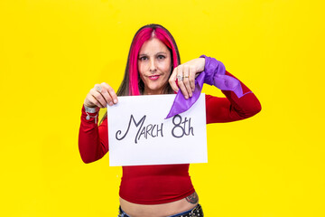 Woman showing march 8th sign and wearing purple ribbon for international women's day