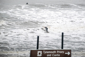 Surfers in winter in the North Sea