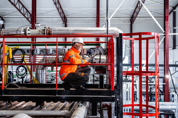 Senior engineer working in industrial power plant maintenance