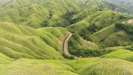 The beautiful and winding roads at the hilltops and across the savanna valleys when the grasses...