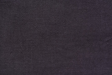 A close-up view of soft, organic cotton textile with a subtle, visible weave pattern.