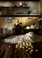Still life with fresh pasta, ingredients and tools for preparation